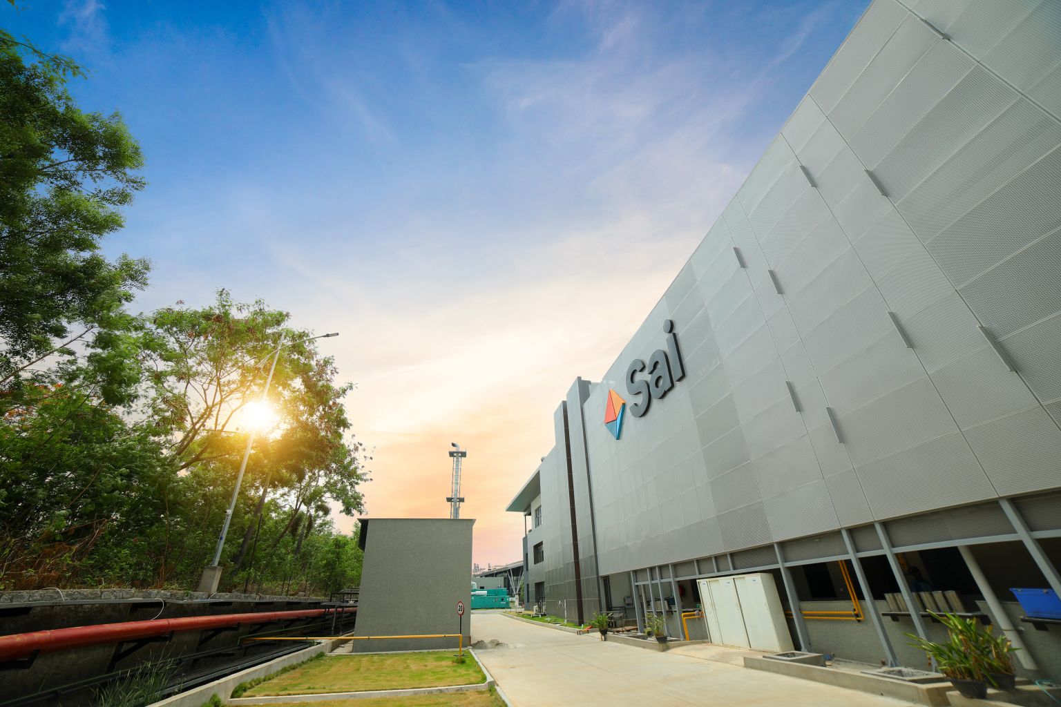 Sai Life Sciences' modern industrial facility at sunset, representing innovation, growth, and commitment to excellence for investors.